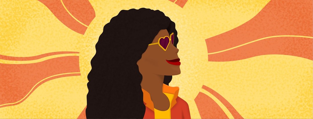 a woman with heart sunglasses smiling