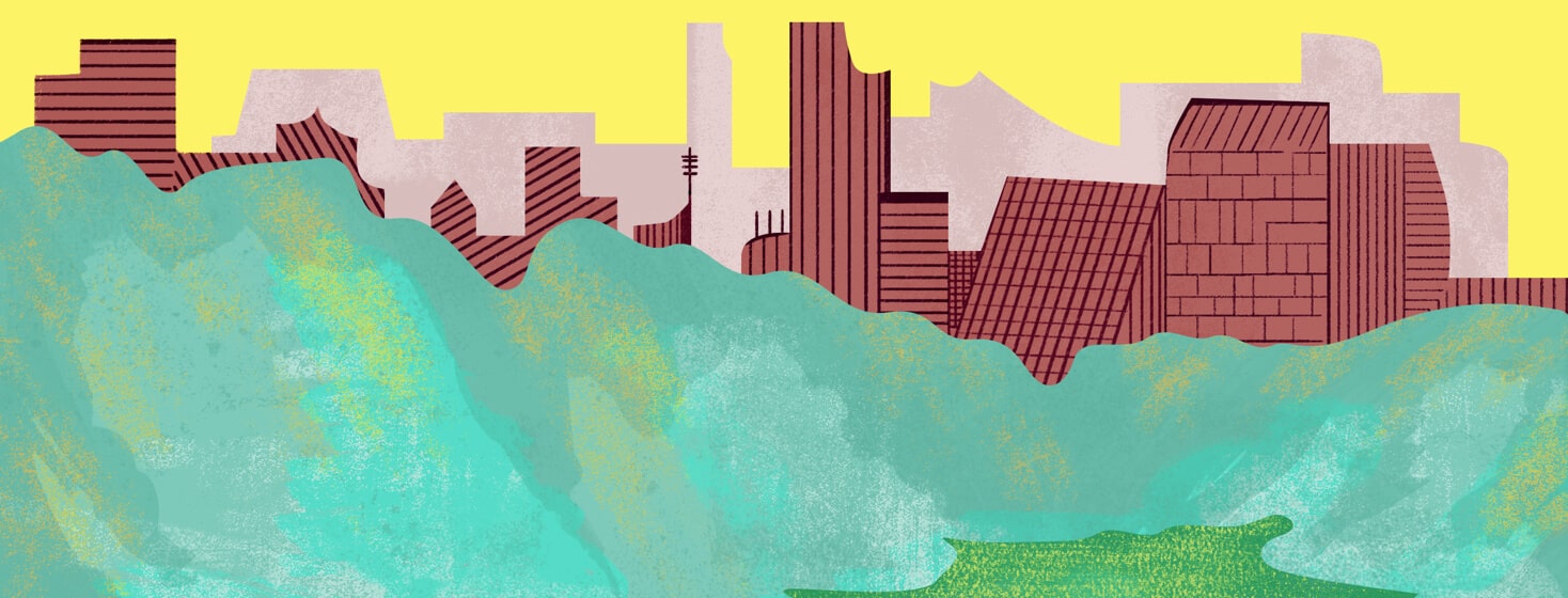 a city scape behind trees