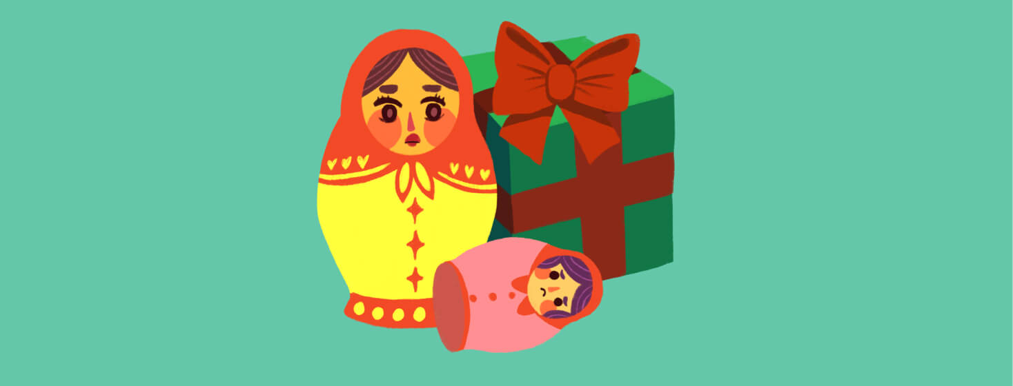 Mother Russian nesting doll is looking at a child nesting doll that has fallen over in concern. There is a gift box behind them. Parenthood, caregiver, children